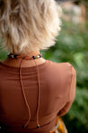 black and brown chunky necklace with large leather tassel