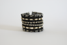 Statement bracelet with black beads and diamond accents 