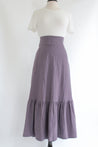 muted purple with ruffles at the bottom wrap skirt